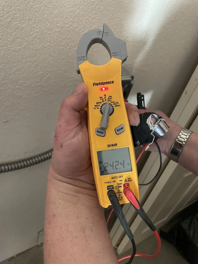 Voltage testing with clamp meter during Aluminum Wiring Replacement in Latimer